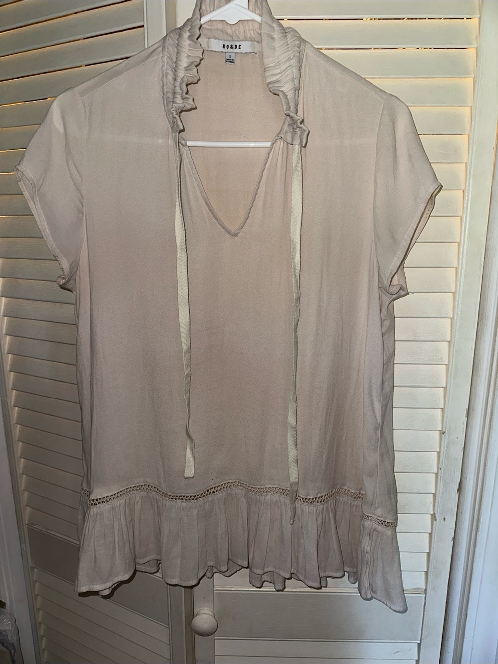 Ro & De Soft Cream Ruffle-Hem Tie-Neck Tunic Top